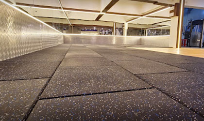 High-quality laminated rubber tiles provide a sleek and professional look for your industrial space.